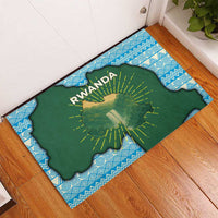 Green Rwanda map doormat with RWANDA text, sunburst rays, and blue patterned border