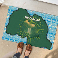 Green Rwanda map doormat with RWANDA text and sunburst rays on blue patterned frame