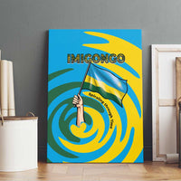 Imigongo canvas wall art front view with hand-waving flag and bold blue yellow green spirals