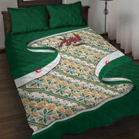 Green quilt bed set with multicolor geometric pattern, Arabic calligraphy and crescent details
