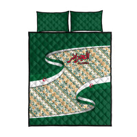 Green quilt bed set with matching pillowcases, multicolor geometric design and Arabic calligraphy