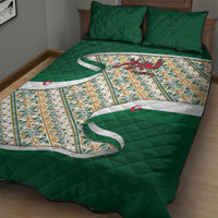 Green quilt bed set featuring multicolor geometric panels, Arabic calligraphy and crescent motifs