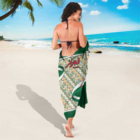 Algerian green sarong with Arabic calligraphy center panel and geometric border, wrap