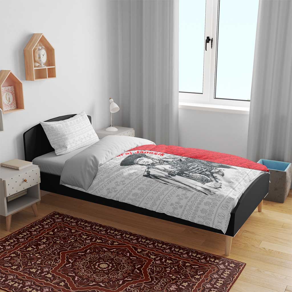 Red and white folk pattern duvet cover with warrior graphic and two pillows on bed