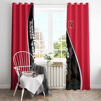 Red window curtain pair with bold black-and-white diagonal Trinidad crest panel