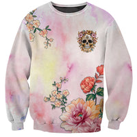 Unisex watercolor gradient sweatshirt with small skull emblem and full floral print
