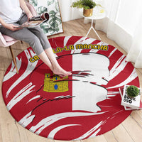 Round red-and-white circular carpet rug with Castilla-La Mancha flag silhouette and text