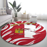 Round red-and-white carpet rug featuring a white silhouette and Castilla-La Mancha wording