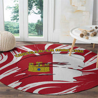 Round red-and-white circular carpet rug with Castilla-La Mancha flag design and castle emblem