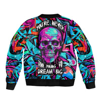Multicolor bomber jacket with back skull graphic and 'Dream Big' lettering, black ribbed hem