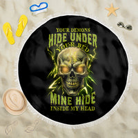 Round black beach blanket with neon green skull artwork and white fringed border