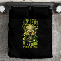 Black bedding set viewed from above with neon skull graphic and matching pillowcases.