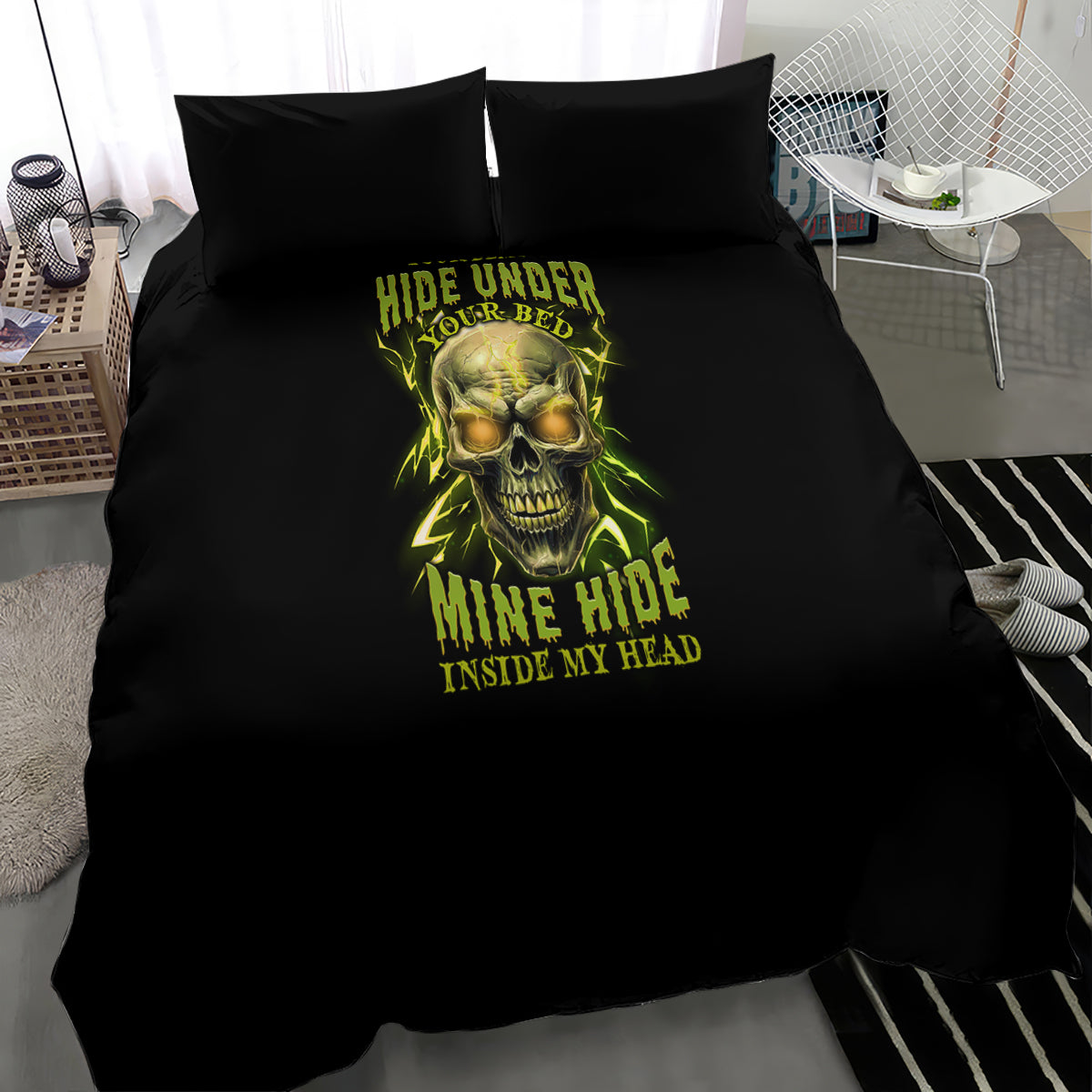 Black duvet bedding set on bed with neon skull design and two black pillowcases.