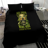 Black duvet bedding set on bed with neon skull design and two black pillowcases.