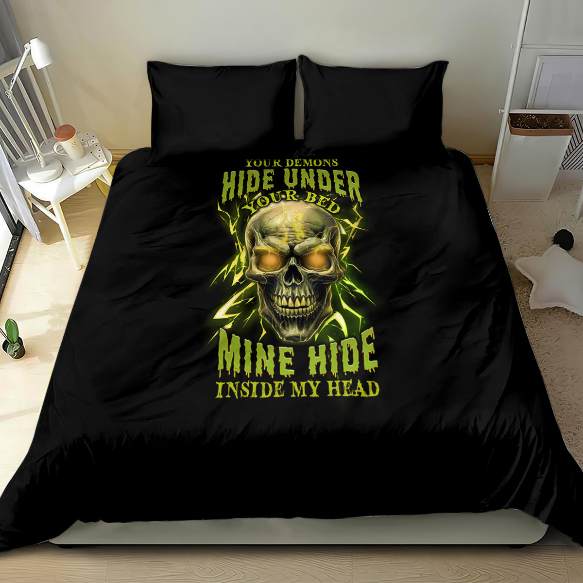 Black bedding set on bed with neon yellow skull graphic and two pillowcases.