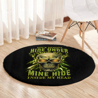 Round black rug with neon green skull graphic and stacked horror-style lettering