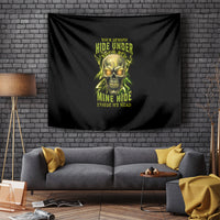 Black wall tapestry with neon green skull graphic and stacked text