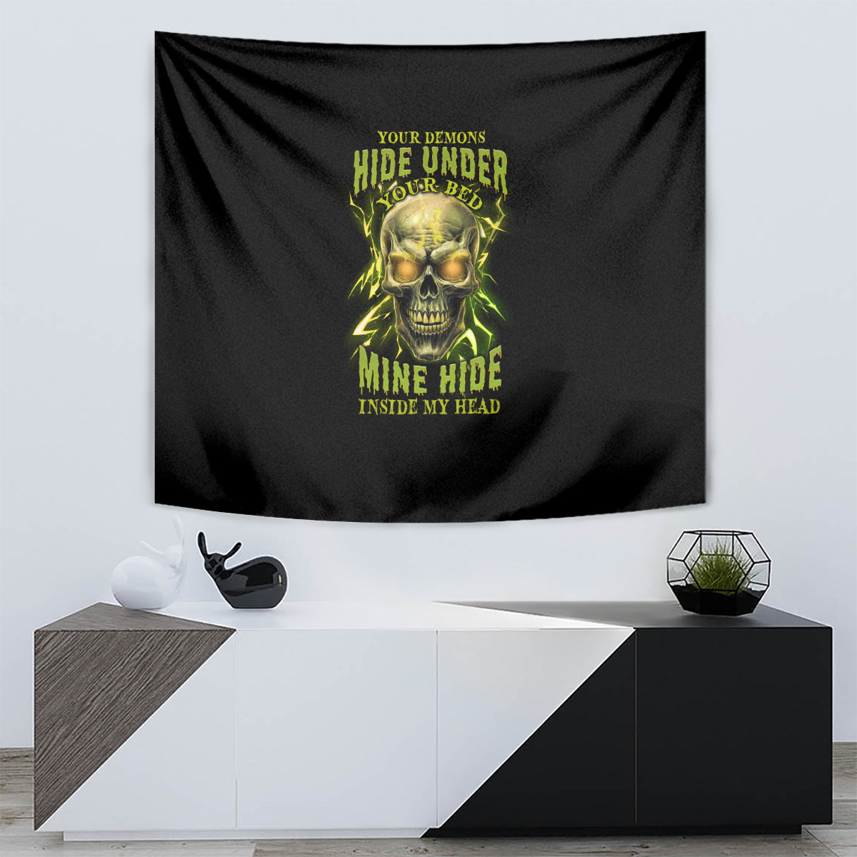 Black hanging tapestry with neon green skull artwork and phrase text