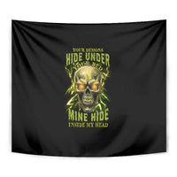 Black tapestry featuring neon green skull and stacked bold lettering