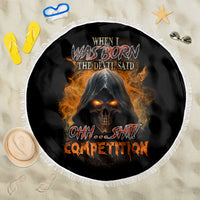 Black round beach blanket with fringed edge, devil skull graphic with orange flames
