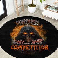 Black round carpet featuring central skull graphic with orange flames and “the devil said” text.