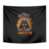 Black tapestry close-up with glowing fiery skull eyes and flame text artwork