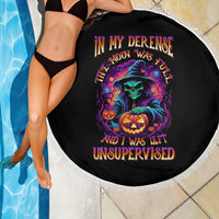 Round black Halloween beach blanket with white fringe edge and colorful skull with jack-o'-lantern