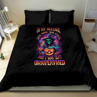 Black Halloween bedding set with witch-and-pumpkin artwork and multicolor wording on duvet