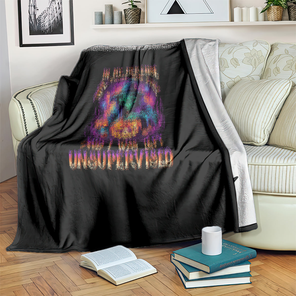 Black Halloween blanket over couch with colorful witch and pumpkin artwork
