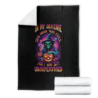 Black Halloween blanket stacked with colorful witch, jack-o'-lantern and 'Unsupervised' text