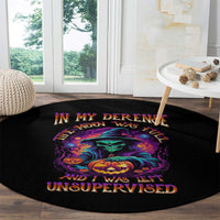 Black round Halloween rug with bright skull, pumpkin, and text graphic
