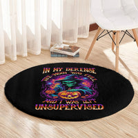 Black round Halloween carpet with colorful skull and pumpkin graphic, centered