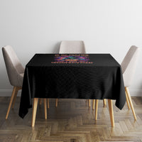 Black Halloween tablecloth with multicolor text graphic centered on the tabletop