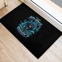 Black rubber doormat with teal skull graphic and 'anti-social friendly' text
