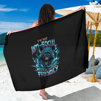 Black sarong with teal skull graphic on back, arms stretched while tied at waist