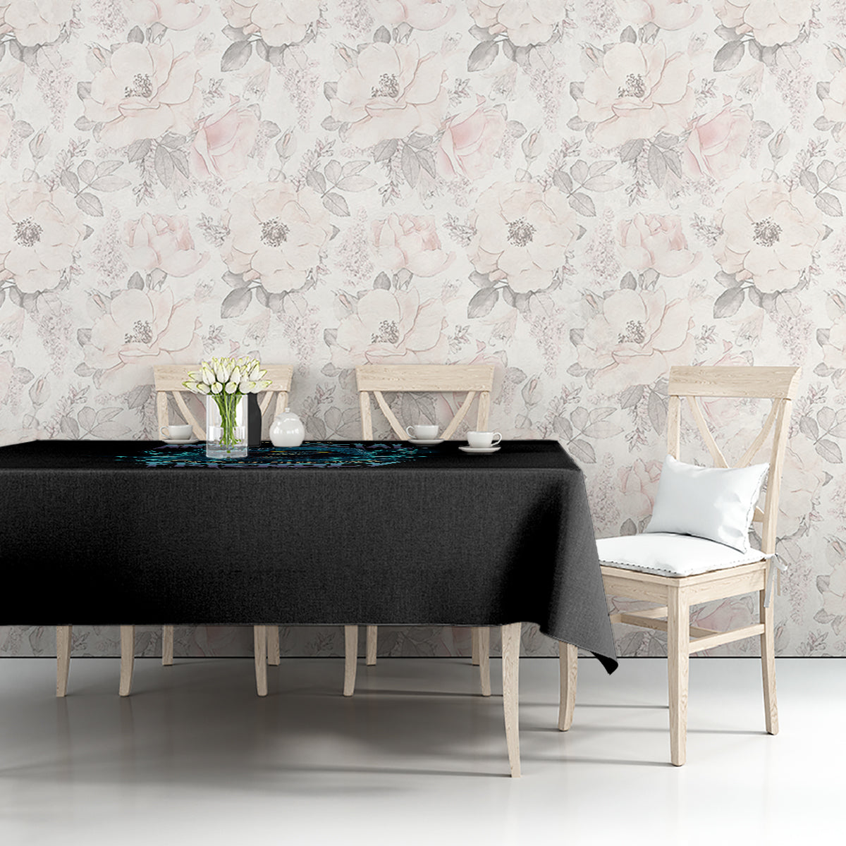 Black tablecloth with dark blue and multicolor graphic near the front