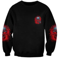 Unisex black sweatshirt with small red-blue skull emblem and red/blue sleeve splashes
