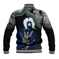 Black varsity baseball jacket with large blue hand emblem, white tribal patterns, striped collar.