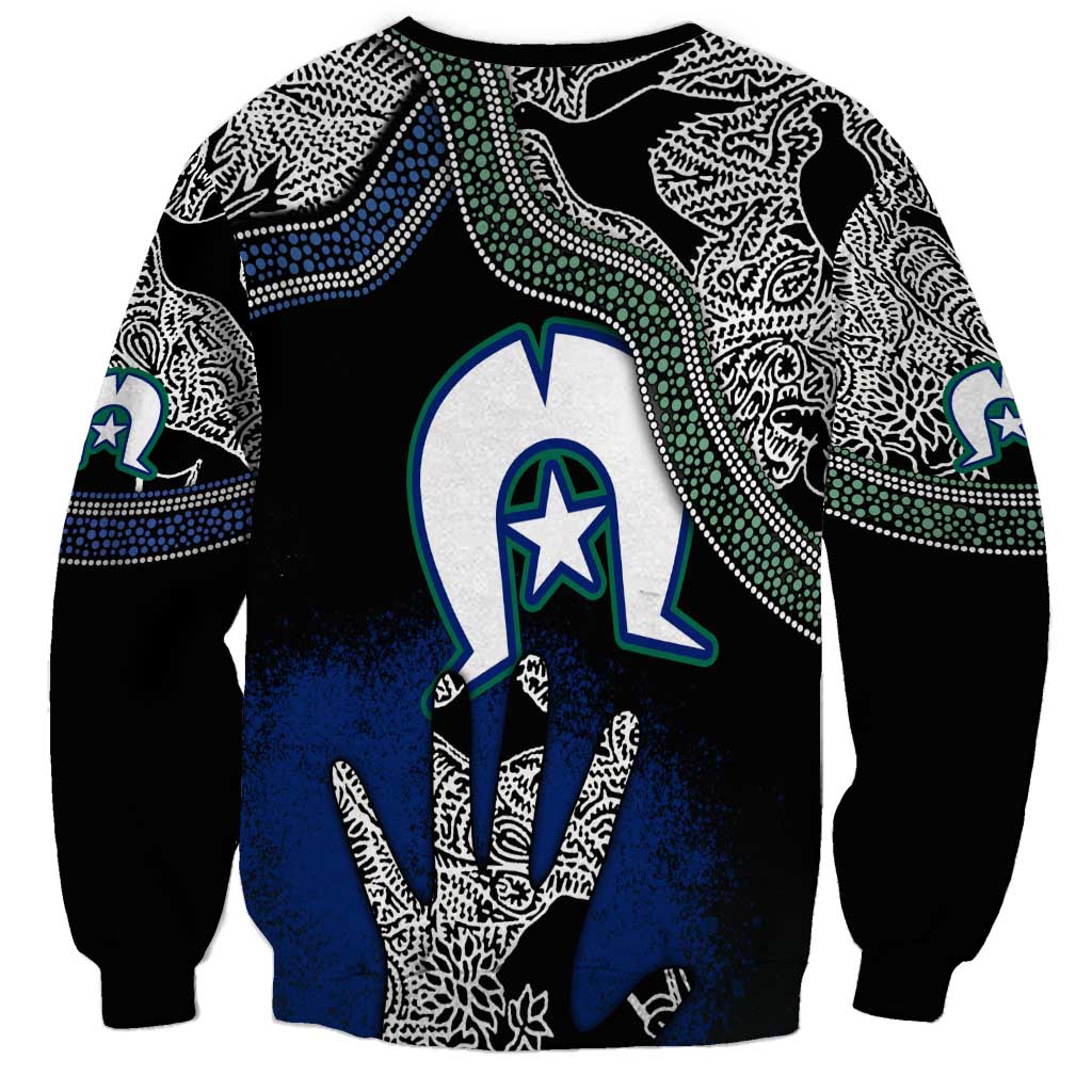 Unisex black sweatshirt with large blue hand graphic, white designs, green star emblem