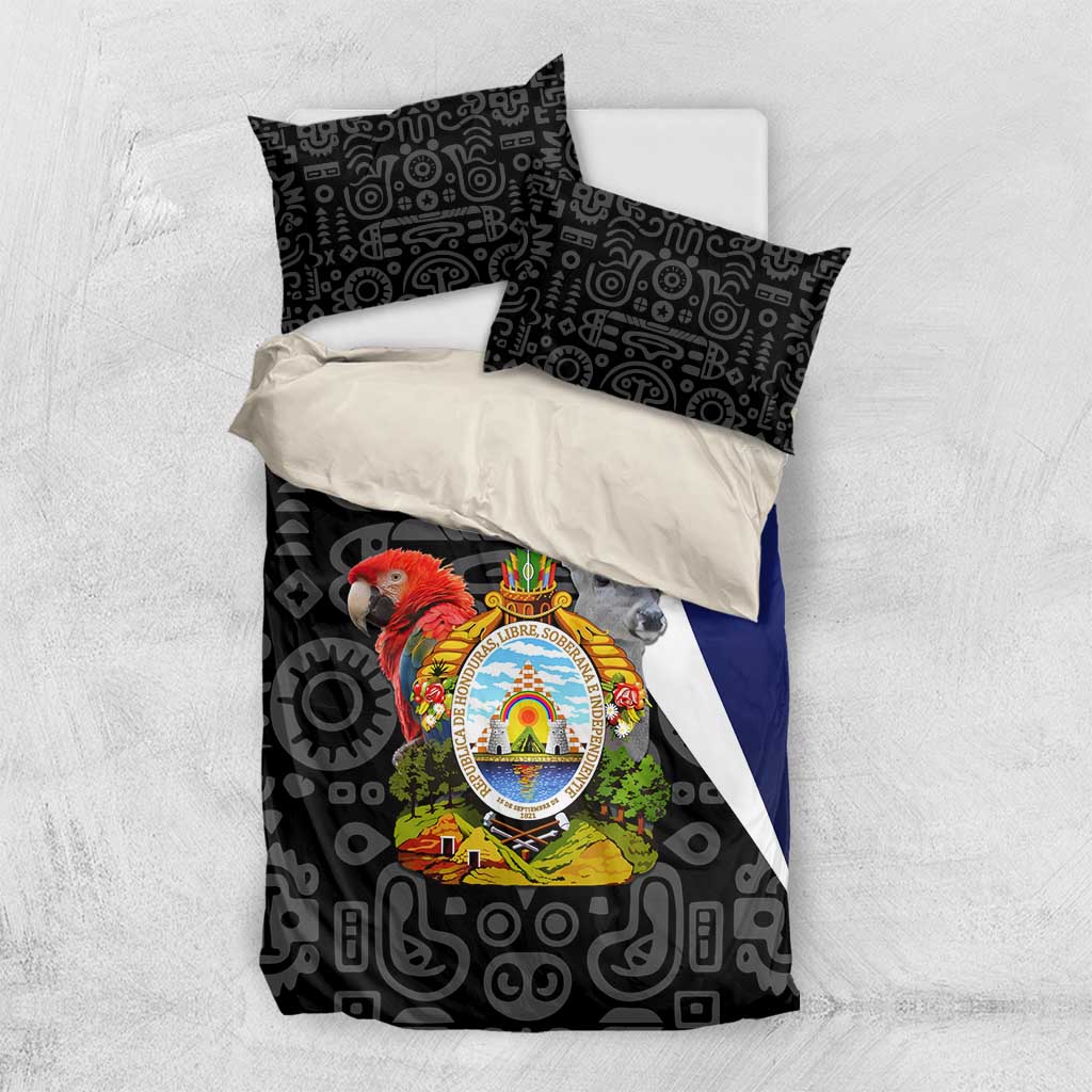 Black patterned bedding set with crest emblem, matching pillowcases, and blue side panel