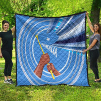 Large blue and white Somalia flag quilt with raised fist, spear, star, and wave stripes