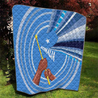 Blue and white quilt featuring Somalia flag design with raised fist, spear, and star