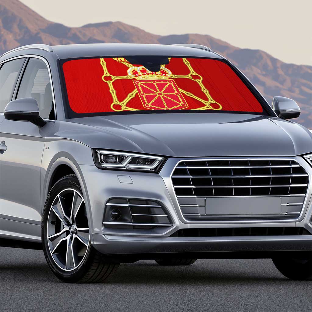 Red car sun shade with gold crest on front windshield