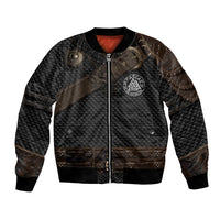 Unisex bomber jacket in dark textured fabric with front zip and round silver emblem