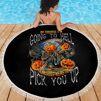 Round black beach blanket with orange pumpkin skull graphic spread on a person’s back