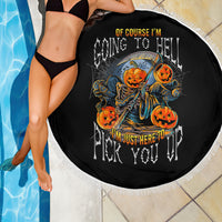 Round black beach blanket with orange pumpkin skull graphic and white fringe border