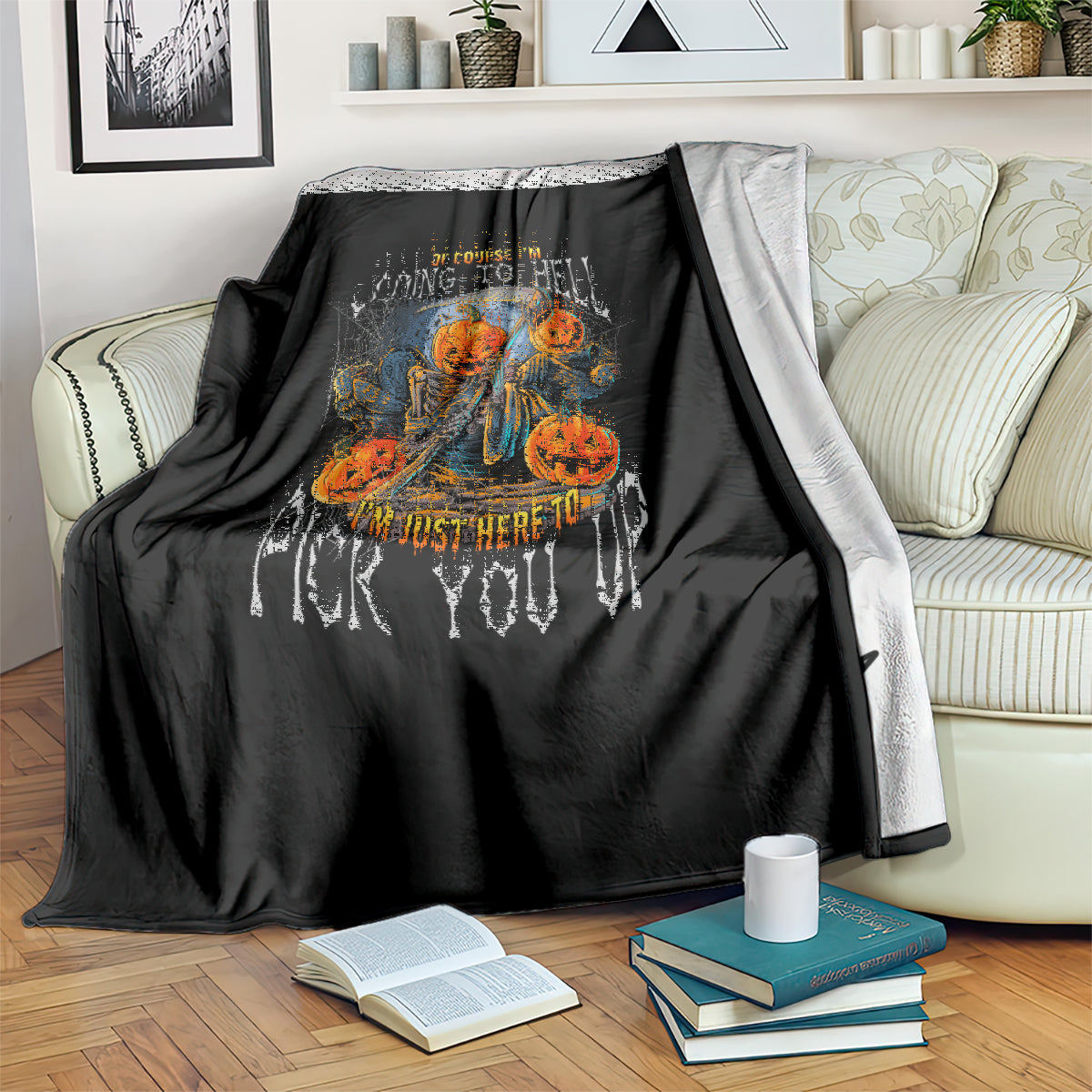 Black Halloween blanket draped over furniture with skull and jack-o'-lantern graphic