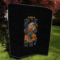 Black Halloween quilt with rounded corners, quilted diamond texture, skull-pumpkin artwork