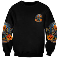 Black sweatshirt with small chest skull-pumpkin graphic and matching printed sleeves