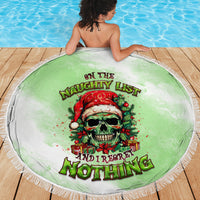 Round green beach blanket with centered skull Santa graphic and fringed edge